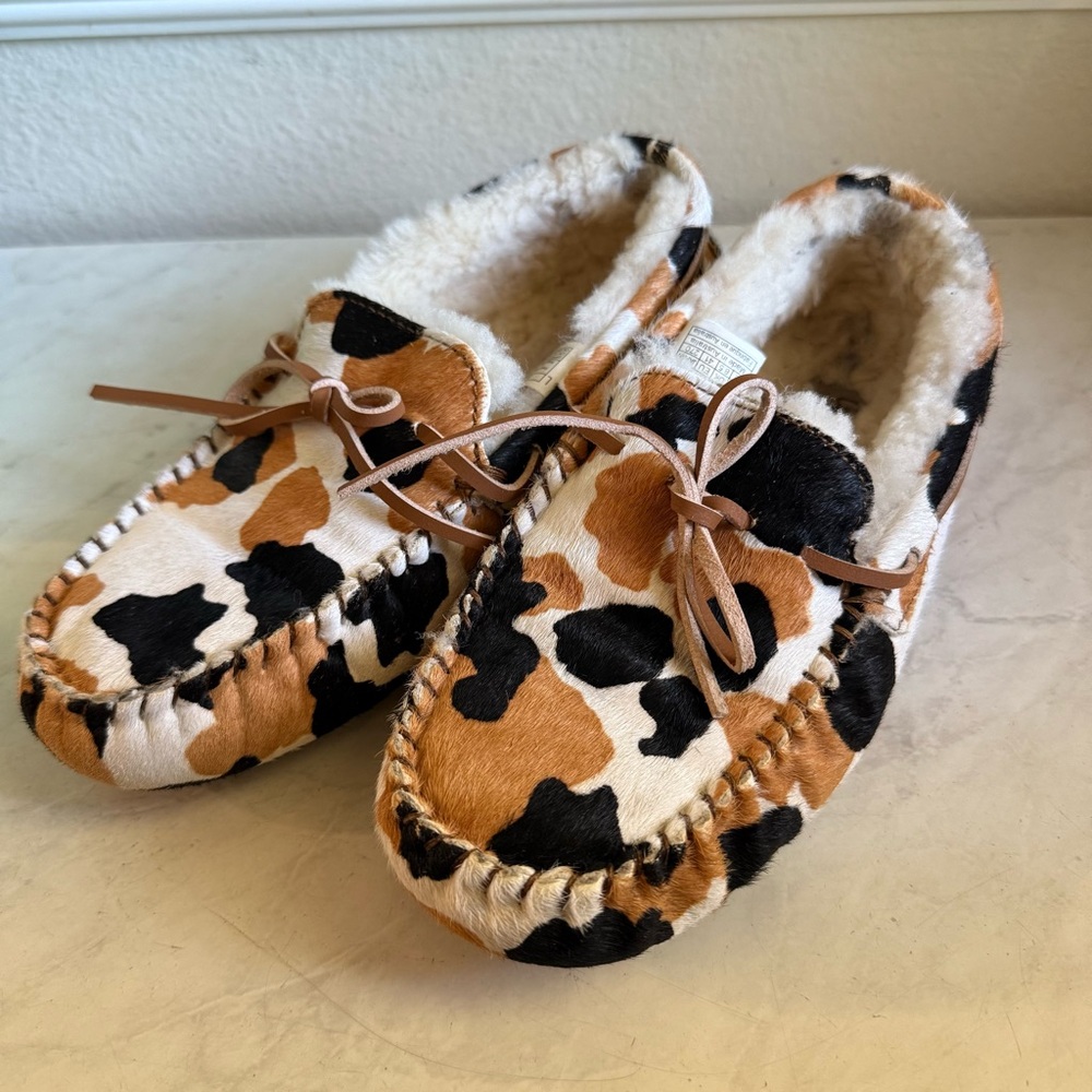 UGG Cow Print Moccasin Slippers in Black, Brown, Cream